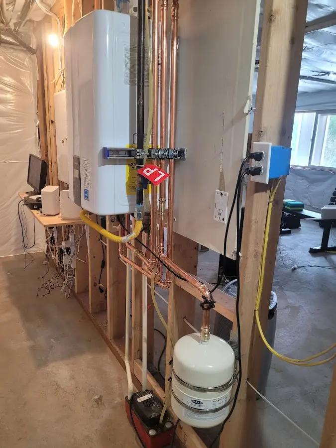 Licensed plumber repairing a kitchen sink in Groesbeck